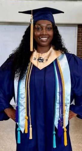 Lucretia McLaughlin - High School Graduate in a cap and gown.