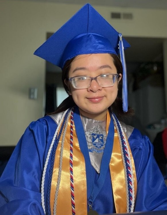 Kristina Nguyen in graduation cap and gown.